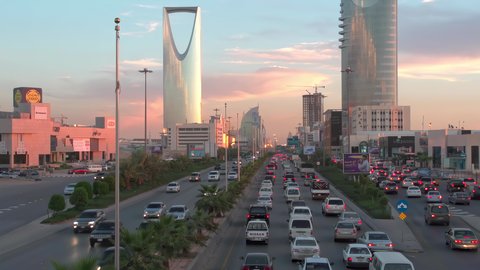 Kingdom Tower at sunset, transportation, aerial drone footage of King Fahd Road in the capital of Saudi Arabia, the growth and development of infrastructure in Riyadh, architectural art of towers and residential and commercial buildings