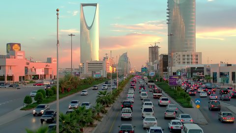Kingdom Tower at sunset, transportation, aerial drone footage of King Fahd Road in the capital of Saudi Arabia, the growth and development of infrastructure in Riyadh, architectural art of towers and residential and commercial buildings
