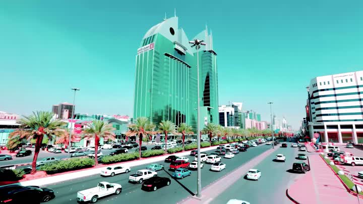 Famous commercial and residential towers during the day, transportation movement, aerial drone photography of King Fahd Road in the capital of the Kingdom of Saudi Arabia, the growth and development of infrastructure in the city of Riyadh, the architectural art of towers and residential and commercial buildings