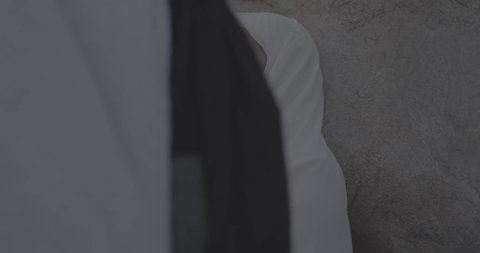 Pilgrims stand on Mount Arafat in the Kingdom of Saudi Arabia. A close-up of a pilgrim praying and turning to God Almighty on Mount Arafat. Reverence and the great feelings of Islamic faith. Performing the duties of Islam in Mecca. Completing the Hajj rituals.  Pilgrim, man, close-up