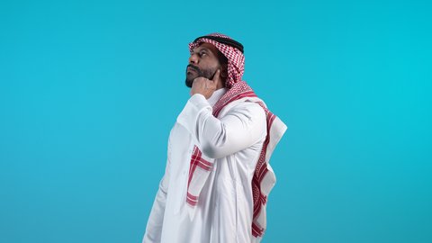 Contemplation and focus to find a solution to a problem, feeling bored and distressed, problems and decision making, a picture of a young Bahraini Gulf Arab man wearing the traditional thobe and shemagh, putting his hand behind his chin, a Saudi man looking up with gestures of thought and confusion