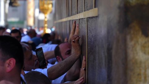Performing the Hajj and Umrah rituals, a destination for Muslims from all over the world, a sacred Islamic religious place and landmark in the Kingdom of Saudi Arabia, the concept of worship and drawing closer to God, a close-up of the Kaaba in Mecca, the Qiblah of Islam and Muslims