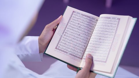 Diligent worship and religious duties, reading and reciting the Holy Quran during the holy month of Ramadan, a Saudi Arabian Gulf man holding the Holy Quran, a Kuwaiti man frequently performing acts of worship and remembering God Almighty.