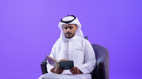 Diligent worship and performing religious duties, reading and reciting the Holy Quran during the blessed month of Ramadan. A Saudi Arabian Gulf man holding the Holy Quran, a Kuwaiti man frequently performing acts of obedience and remembering God Almighty.