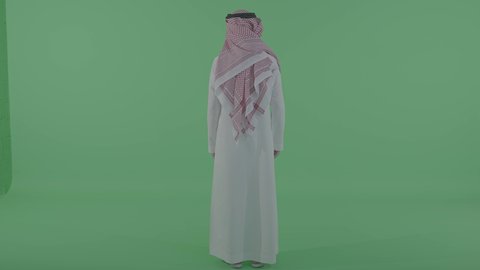 الاهتمام بالمظهر الخارجي, مفهوم الرجولة والأناقة، بورتريه من الخلف لرجل عربي خليجي سعودي يرتدي الثوب التقليدي والشماغ يقف باستقامة و ينظر الى شيء ما فى الاعلي ، الجسم بالطول الكامل ، خلفية خضراء ، كروما