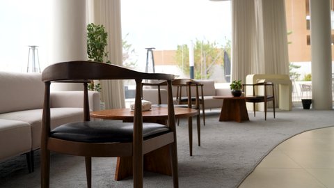 Modern office equipment with elegant and comfortable furniture, sophisticated interior designs and decorations in a modern style, contemporary design for offices of companies in the Kingdom of Saudi Arabia, large glass facades in the workplace.