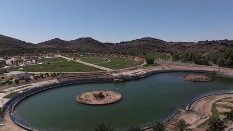 Gardens and recreational parks in the Kingdom of Saudi Arabia, vast green spaces, a famous natural landmark and tourist site, entertainment, fun and amusement games for children in one of the parks of Hail City, a family entertainment park