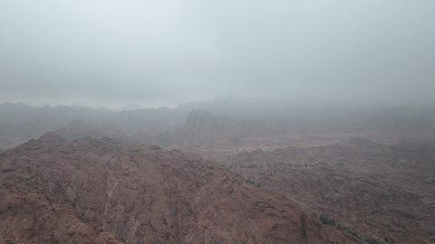 Mountains and rock formations in the desert regions of the Kingdom of Saudi Arabia, an ancient historical archaeological site, terrain, peaks and mountain heights in the desert, drone photography of mountains in the city of Hail
