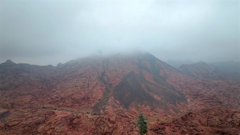 Mountains and rock formations in the desert regions of the Kingdom of Saudi Arabia, an ancient historical archaeological site, terrain, peaks and mountain heights in the desert, drone photography of mountains in the city of Hail