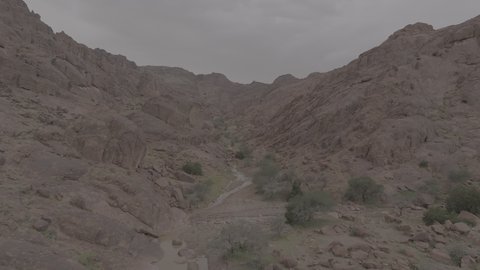 An ancient historical archaeological site, terrain, peaks, and mountain heights in the desert, drone photography of the Aja Mountains in the city of Hail, mountains and rock formations in the desert regions of the Kingdom of Saudi Arabia