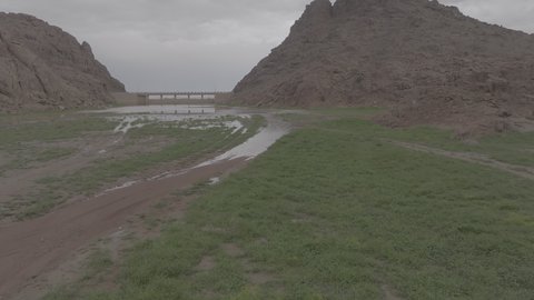 An ancient historical archaeological site, the terrain, peaks and mountain heights in the desert, a drone shot of the Aja Mountains in the city of Hail, mountains and rock formations in the desert regions of the Kingdom of Saudi Arabia