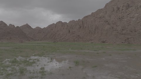 An ancient historical archaeological site, the terrain, peaks and mountain heights in the desert, a drone shot of the Aja Mountains in the city of Hail, mountains and rock formations in the desert regions of the Kingdom of Saudi Arabia