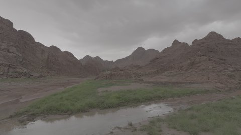 An ancient historical archaeological site, the terrain, peaks and mountain heights in the desert, a drone shot of the Aja Mountains in the city of Hail, mountains and rock formations in the desert regions of the Kingdom of Saudi Arabia