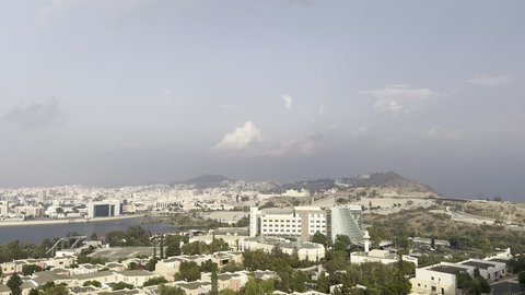 Abha mountain ranges, rugged terrain and stone roads, aerial photography of the mountainous environment in the Asir region, green nature, beautiful parks and gardens, trees and plants on the mountain slopes