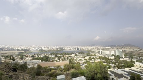 Abha mountain ranges, rugged terrain and stone roads, aerial photography of the mountainous environment in the Asir region, green nature, beautiful parks and gardens, trees and plants on the mountain slopes