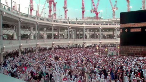 Visiting the Holy House of God in Mecca, performing the Hajj and Umrah rituals, the concept of worship and drawing closer to God Almighty, attracting and attracting Muslims from all over the world, pilgrims and Umrah performers circumambulating the Holy Kaaba in the Holy Mosque of Mecca