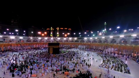 Circumambulating the Kaaba in Mecca, Saudi Arabia, performing Hajj and Umrah, attracting Muslims from all over the world, a destination for people to perform religious duties, the concept of worship and drawing closer to God Almighty