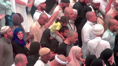 Pilgrims stand on Mount Arafat in the Kingdom of Saudi Arabia, praying and turning to God Almighty on the Mount of Mercy, humility and great Islamic feelings of faith, performing the duties of Islam in Mecca, completing the Hajj rituals