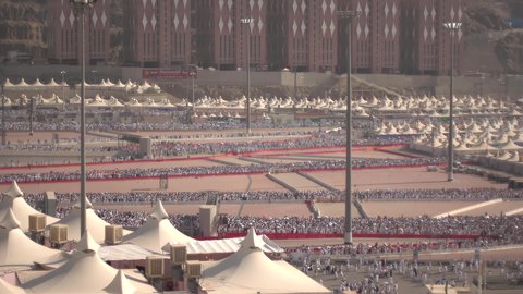 Completing the Hajj rituals, spending the night in the Sacred Sites during the day, a sacred Islamic religious site in the Kingdom of Saudi Arabia, pilgrims marching to the tents in Mina in the city of Mecca