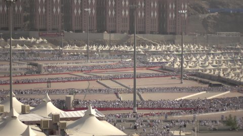 A sacred Islamic religious place in the Kingdom of Saudi Arabia, pilgrims march to the tents in Mina in the city of Mecca, completing the Hajj rituals, spending the night in the sacred sites during the day