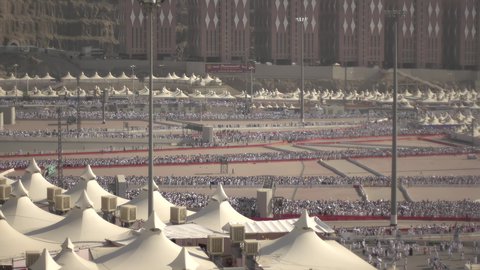 Completing the Hajj rituals, spending the night in the Sacred Sites during the day, a sacred Islamic religious site in the Kingdom of Saudi Arabia, pilgrims marching to the tents in Mina in the city of Mecca