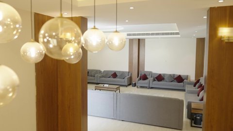 A living room with luxurious home furniture, the interior design of the living room in a modern style in one of the luxury chalets, equipping the suite with all high-end furnishings, elegant interior decor for villas and residential apartments in the Sultanate of Oman.