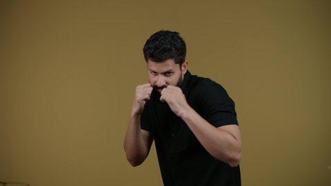 Self-defense practice, boxing training, physical activity, increasing muscle endurance, illustration of a young Emirati Gulf Arab man wearing casual clothes raising his fists with a gesture of strength, yellow background
