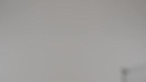 Buying essential supplies and necessities, enjoying shopping in malls and shopping centers, portrait of an Arab Gulf Emirati woman wearing a colorful abaya shopping and pulling a cart with her daughter, a Gulf girl pointing to something