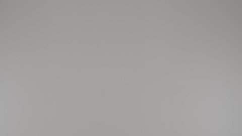 Enjoy shopping, take advantage of seasonal offers and discounts, portrait of an Arab Gulf Emirati woman wearing a colorful abaya shopping, a Saudi woman pulling a cart and pointing to something