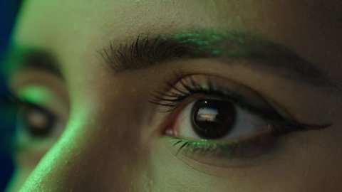 The progress and urban development in the country, a civilizational and urban renaissance, a close-up shot of the eye of a Saudi Arabian Gulf Arab girl looking at the landmarks and terrain of the Kingdom of Saudi Arabia.