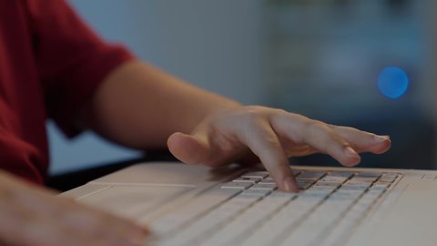 Browsing the internet and chatting, communicating with friends, e-learning in Saudi Arabia, children's use of modern technology, close-up of a Saudi Arabian Gulf boy's hand sitting in a wheelchair using a laptop, making a video call.