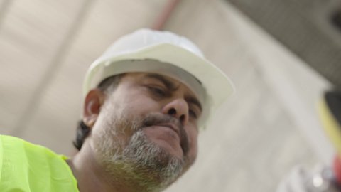Crafts and manual industries, close-up shot of a Saudi Arabian Gulf Arab worker polishing and shining marble, a local national product, stone and marble factory in the Kingdom of Saudi Arabia.