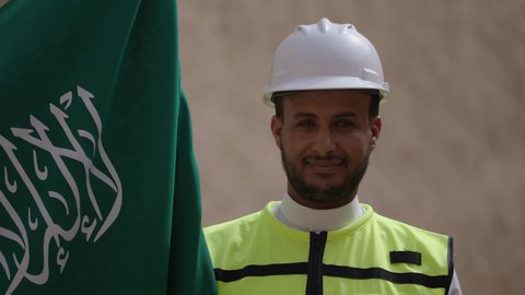 The principles of building heritage houses and palaces, the day we began in 1727 AD, National Day, September 23, learning about ancient architecture, the anniversary of the founding of the first Saudi state, February 22, a Saudi Gulf Arab engineer wearing a jacket and helmet carrying the national emblem to celebrate Flag Day, March 11, a walk through the popular neighborhood