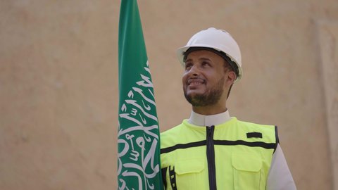 Construction basics for heritage houses and palaces, the day we started in 1727 AD, National Day September 23, learning about ancient architecture, the anniversary of the founding of the first Saudi state February 22, a Saudi Gulf Arab engineer wearing a jacket and helmet carrying the national emblem to celebrate Flag Day March 11, a tour of the popular district