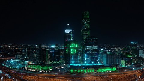 King Abdullah Financial District (KAFD), economic and urban renaissance, aerial drone footage of Riyadh's skyline at night, modern and sophisticated towers and skyscrapers, famous commercial and economic landmarks