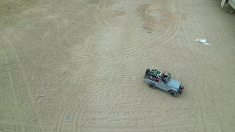 Safari trips in the deserts of the Kingdom of Saudi Arabia, spending a unique trip in the desert environment, driving an old white jeep in the Najran Valley, (dune-riding) in the middle of the desert, an exciting safari adventure on the sand dunes and hills, a fun recreational activity