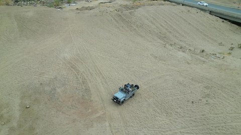 Safari trips in the deserts of the Kingdom of Saudi Arabia, spending a unique trip in the desert environment, driving an old white jeep in the Najran Valley, (dune-riding) in the middle of the desert, an exciting safari adventure on the sand dunes and hills, a fun recreational activity