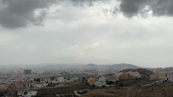 Famous natural tourist attractions and landmarks, foggy weather in southern Saudi Arabia, rock formations and mountain ranges, drone footage of Abha Viewpoint in Asir Region