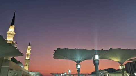 Electronic sunshades, sacred Islamic religious landmarks, the courtyard of the Prophet's Mosque in Medina, Saudi Arabia, worship and drawing closer to God Almighty, Muslims gathered in the outer complex of the Prophet's Mosque