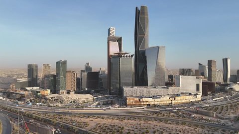 King Abdullah Financial District (KAFD), the economic and urban renaissance, aerial drone photography of the Riyadh skyline during the day, modern and advanced towers and skyscrapers, famous landmarks of commerce and the economy