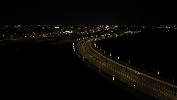 Traffic on roads and streets in the Kingdom of Saudi Arabia, aerial drone photography of the city of Hail at night, famous tourist attractions, improving and preparing infrastructure in cities