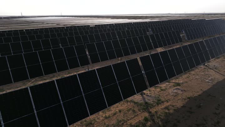 Solar cells for generating alternative energy, Saudi Vision 2030, sustainable development and advancement of renewable and clean energy sources in Saudi Arabia, drone photography of a group of solar panels over large areas