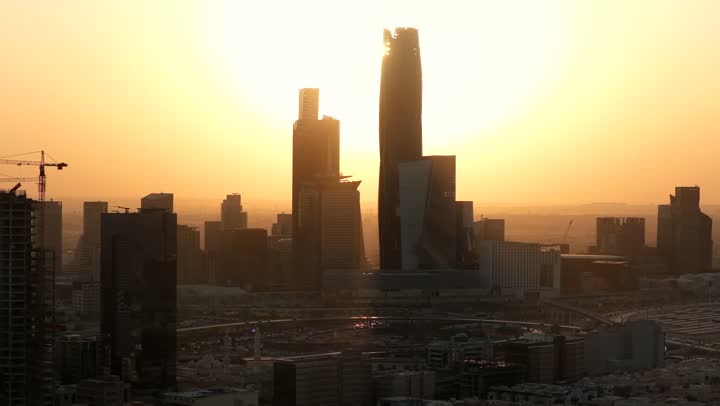 King Abdullah Financial District (KAFD) towers in Riyadh at sunset, the main destination for finance and business, modern and advanced architectural art, achieving economic and commercial renaissance, growth and urban progress of skyscrapers in the Kingdom of Saudi Arabia