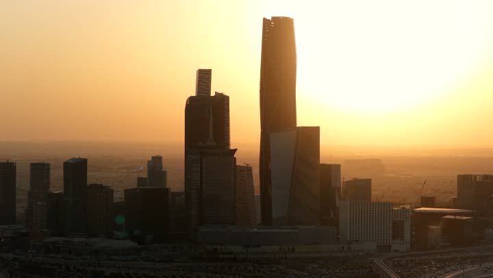 King Abdullah Financial District (KAFD) towers in Riyadh at sunset, the main destination for finance and business, modern and advanced architectural art, achieving economic and commercial renaissance, growth and urban progress of skyscrapers in the Kingdom of Saudi Arabia