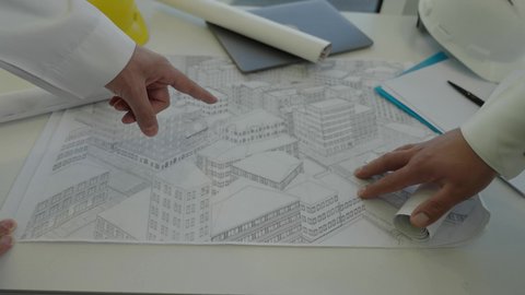 التخطيط ووضع اللمسات الأخيرة على المخططات المعمارية، تصوير مقرب لفريق عمل خليجي سعودي يعمل على مناقشة مخطط الإنشاء وتحديد القياسات بدقة، الأعمال الهندسية في المملكة العربية السعودية، الشركات المختصة بورشات البناء والمقاولات، متابعة تنفيذ الخطط الموضوعة مسبقا