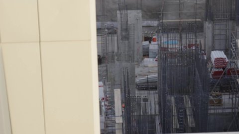 The concept of structural and architectural engineering, the use of machinery, equipment and high scaffolding, the implementation of the construction plan and the formation of the metal structure, construction work, pouring concrete and laying foundations, buildings under construction using modern machinery