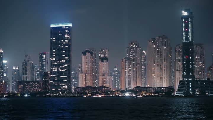 Dubai's famous tourist attractions, the waterfront overlooking the Arabian Gulf, sailing in the harbor and yacht marina in Dubai Marina, the architectural art of the buildings and structures overlooking the sea, the progress and urban growth of towers and skyscrapers in the United Arab Emirates