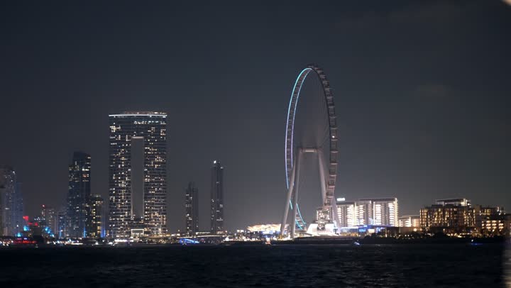 Dubai's famous tourist attractions, the waterfront overlooking the Arabian Gulf, sailing in the harbor and yacht marina in Dubai Marina, the architectural art of the buildings and structures overlooking the sea, the progress and urban growth of towers and skyscrapers in the United Arab Emirates