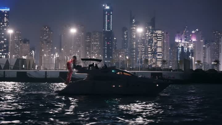 The progress and urban growth of towers and skyscrapers in the United Arab Emirates, the famous tourist attractions of Dubai, the waterfront overlooking the Arabian Gulf coast, sailing in the harbor and yacht marina in Dubai Marina, the architectural art of buildings and structures overlooking the sea