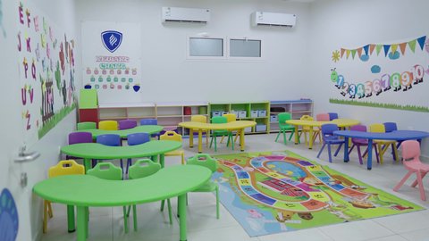 Academic schools in the Kingdom of Saudi Arabia, teaching foreign languages to elementary school students, the correct way to draw and write English letters, distinctive illustrative tools.